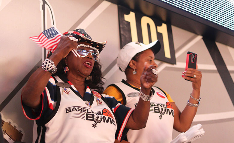 Peggy Dickerson, 10-year season ticket holder and Baseline Bum, cheers on the San Antonio Spurs. Photo by David Mandujano
